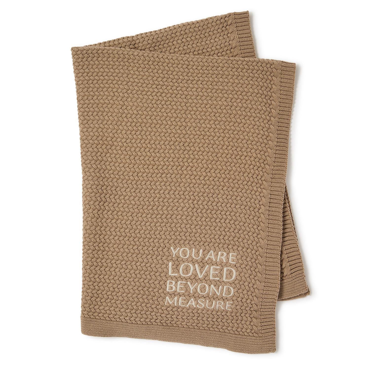 Brown textured knit baby blanket, “YOU ARE LOVED BEYOND MEASURE” embroidered in white. Sizes available: 30"x40".