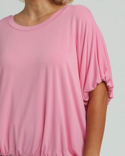 Loose-fitting pink Bubble Sleeve & Hem Top with gathered sleeves and elastic hem, made from soft bamboo fiber. Available in sizes XS-XL.