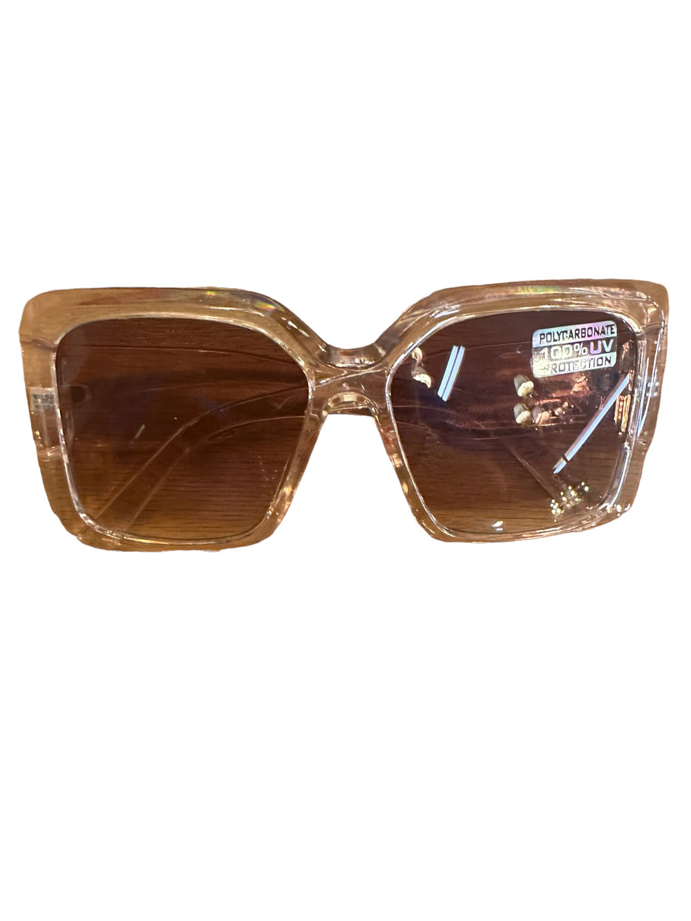 Large Square Frame Sunglasses with clear, light brown frames and brown lenses. "Polycarbonate 100% UV Protection" sticker on the right lens. Available sizes: large.