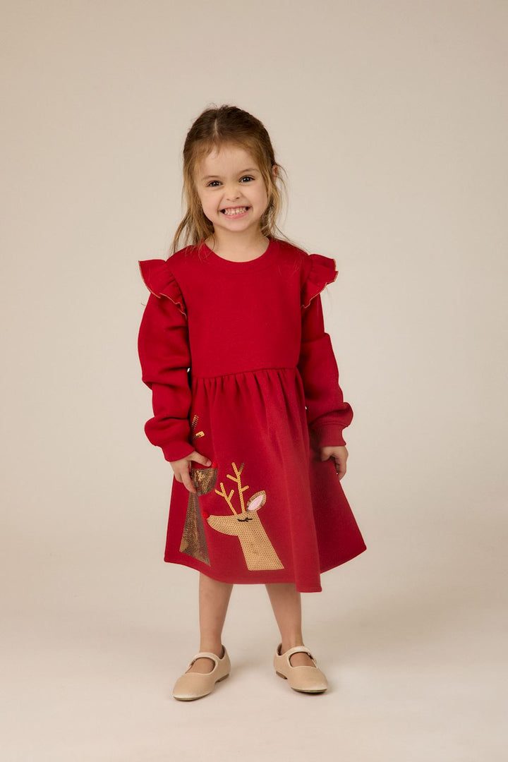 Red long-sleeve sequin reindeer ruffle dress with ruffled shoulders. Available in various sizes.
