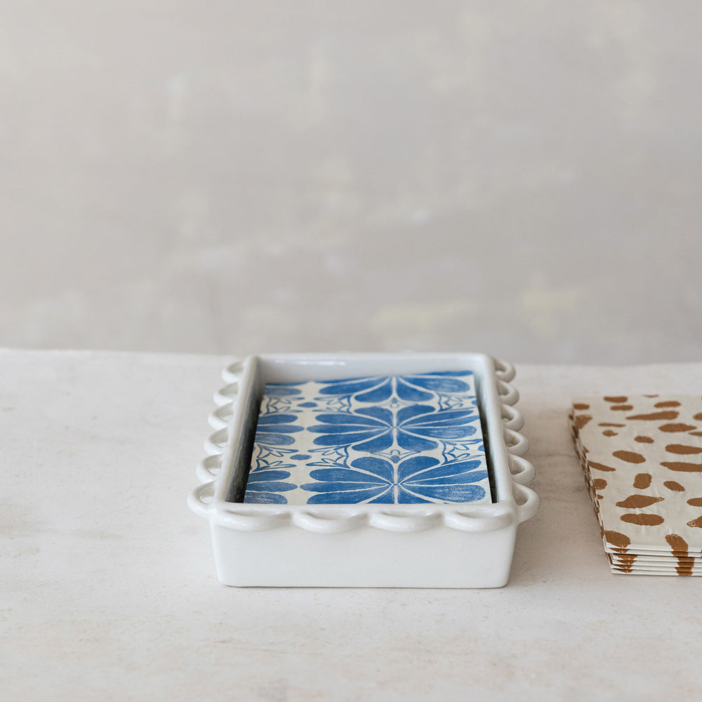 White ceramic scalloped napkin holder with blue and white floral tile accent. Available in small and large sizes.
