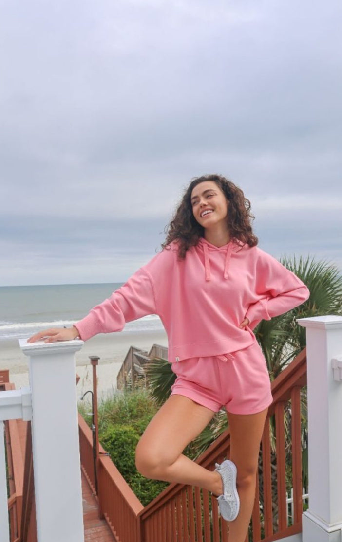 Long sleeve hoodie top, which is pink with the drawstring hoodie