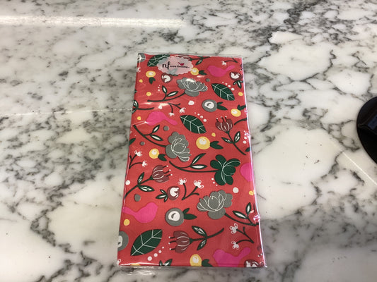 Rectangular pack of Cardinal Guest Towels wrapped in floral paper, red, green, white, and yellow. Available in standard sizes.