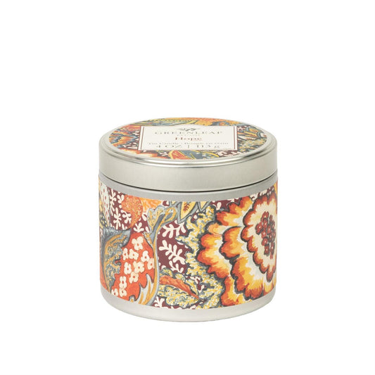 Hope Tin Candle: round tin, silver lid, vibrant floral pattern. Fresh fruit spice scent. Product name on lid. Available in various sizes.