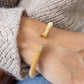 Cuff Paris gold mesh hypoallergenic bracelet with polished cylindrical ends; available in S, M, and L.