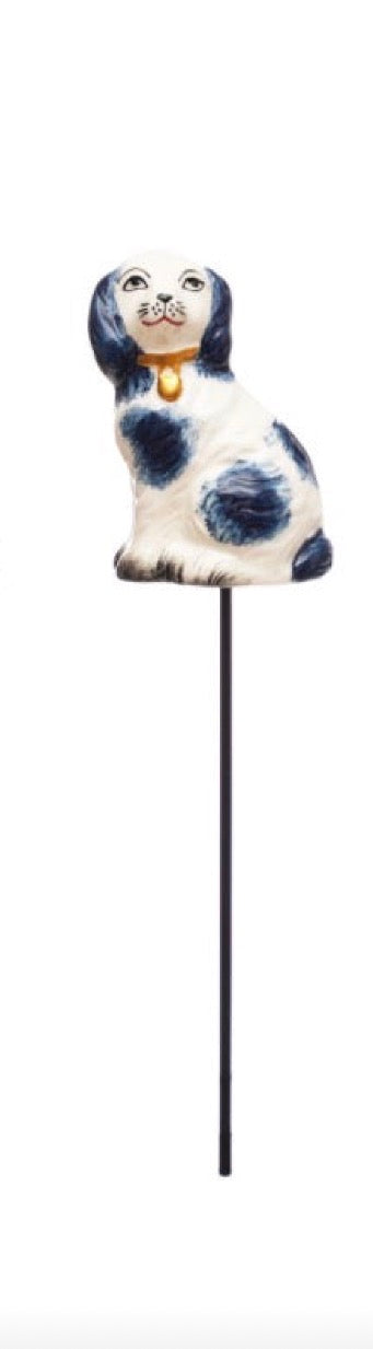 Hand-painted ceramic dog figurine with blue spots and a yellow collar on a black stake. Available sizes: small, medium, large.