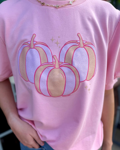 Pink Pumpkin Short Sleeve Sweatshirt featuring three pastel pumpkins outlined in gold and pink with small gold star accents; available in sizes S-XXL.