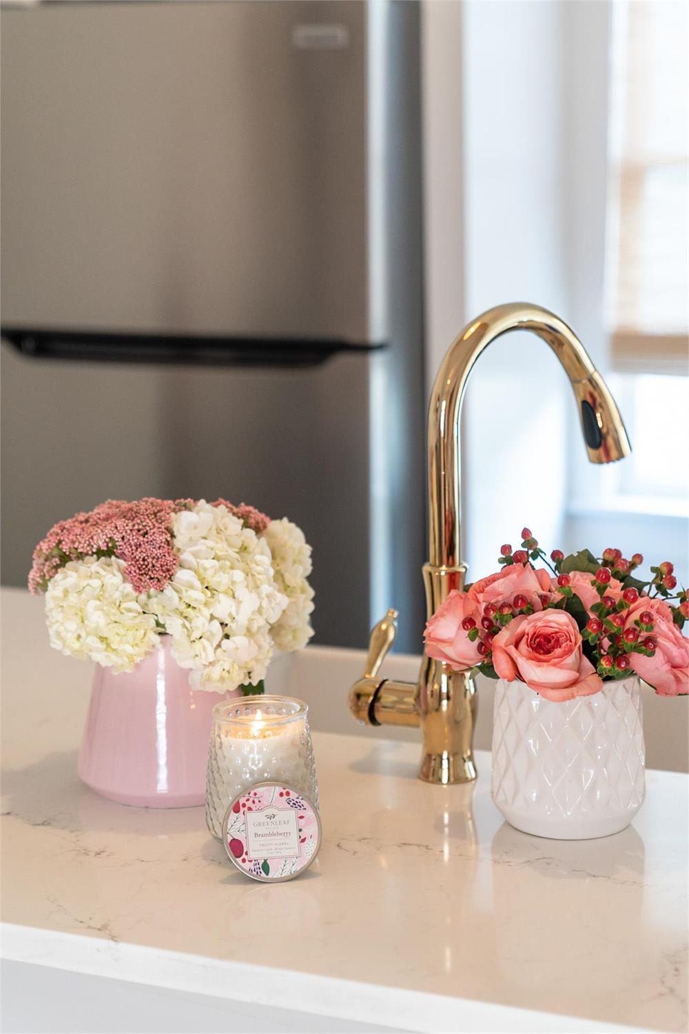 Brambleberry Signature Candle in a clear glass jar with a floral label.
