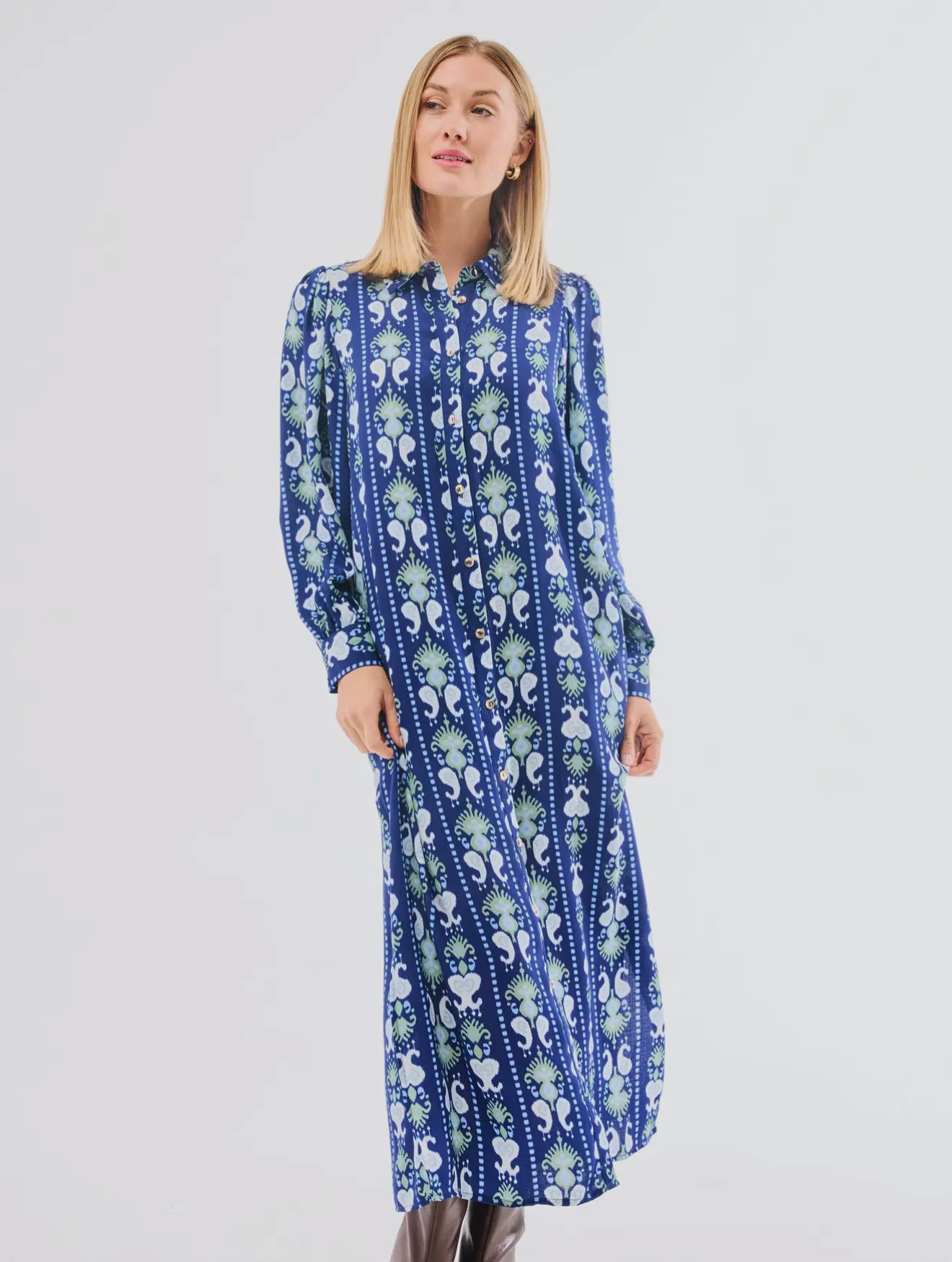 Ava Ikat Stripe Dress: ankle-length, long-sleeved blue dress with white/light blue floral and stripe patterns. Sizes XS–XL.
