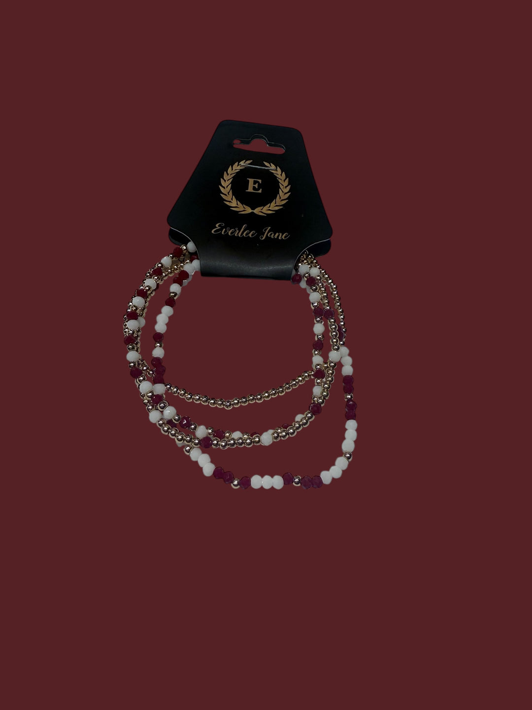 Set of 4 maroon, white, and gold glass bead stretch bracelets. Available in S, M, L.