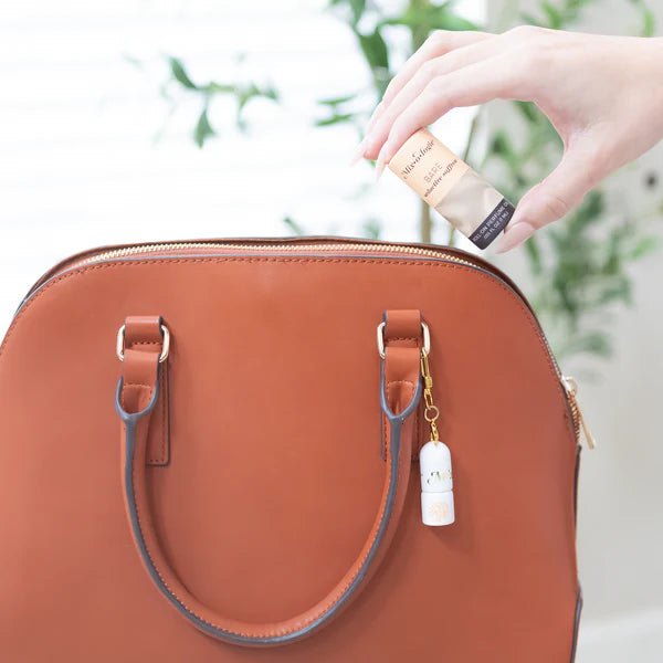 Keychain Mini Rollerball Perfume, compact size, fits in hand. Available sizes: 5ml and 10ml.