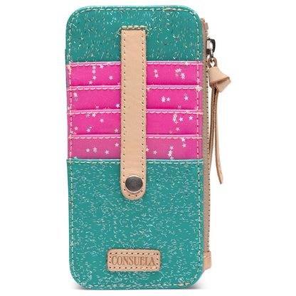 Card Organizer Shay: compact wallet with teal and pink sections, tan accents, snap closure, strap, “Consuela” patch at bottom, and white star patterns on pink area. Available in one size.