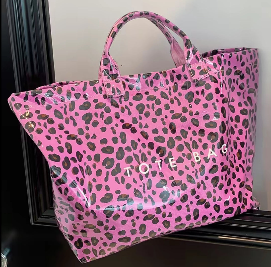 Pink Vintage Tote Bag with black and purple leopard spots, sturdy handles, bold white "TOTE BAG" print. Available in S, M, L.