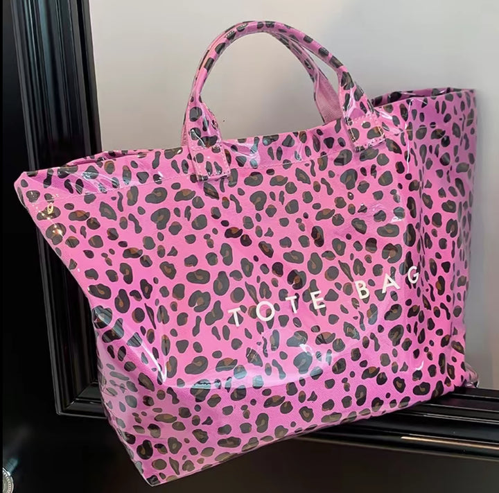 Pink Vintage Tote Bag with black and purple leopard spots, sturdy handles, bold white "TOTE BAG" print. Available in S, M, L.