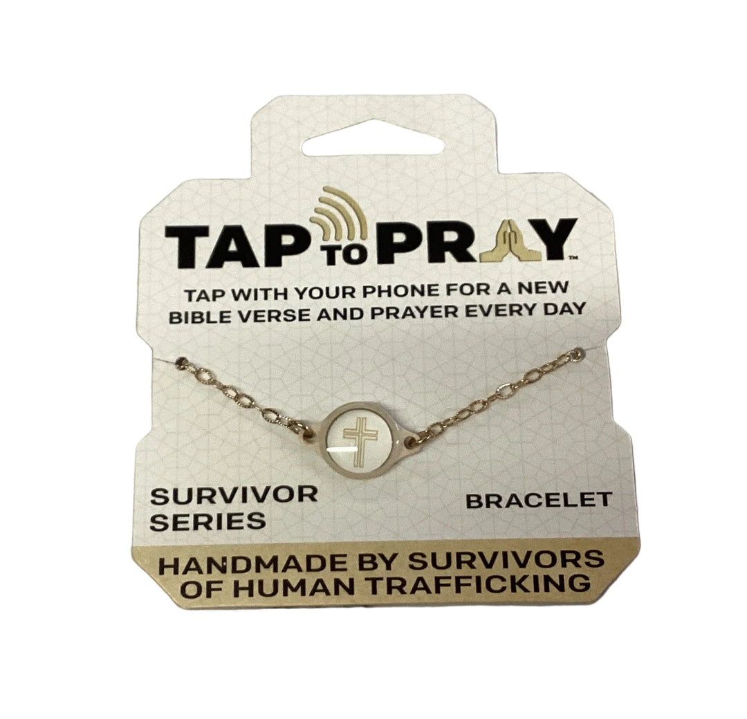 Gold-tone Tap To Pray bracelet with circular cross charm on a branded mission card.