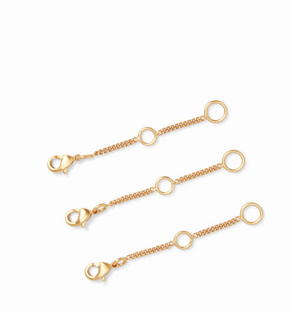 Julie Vos Extender Set: three 24K gold-plated necklace extenders with lobster clasps and round loops. Size: standard length.