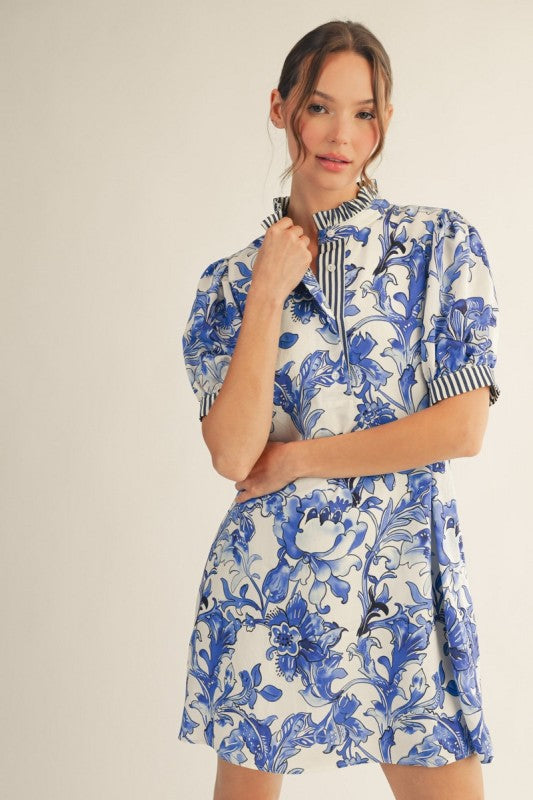 Royal Blue Floral Dress: short white with blue blooms, ruffled neckline, striped collar/sleeves. Sizes: XS-XL.