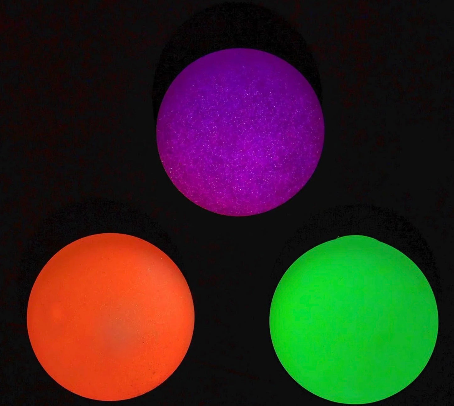 Glow In The Dark Blob Squishy available in purple, orange, and green; multiple sizes offered.
