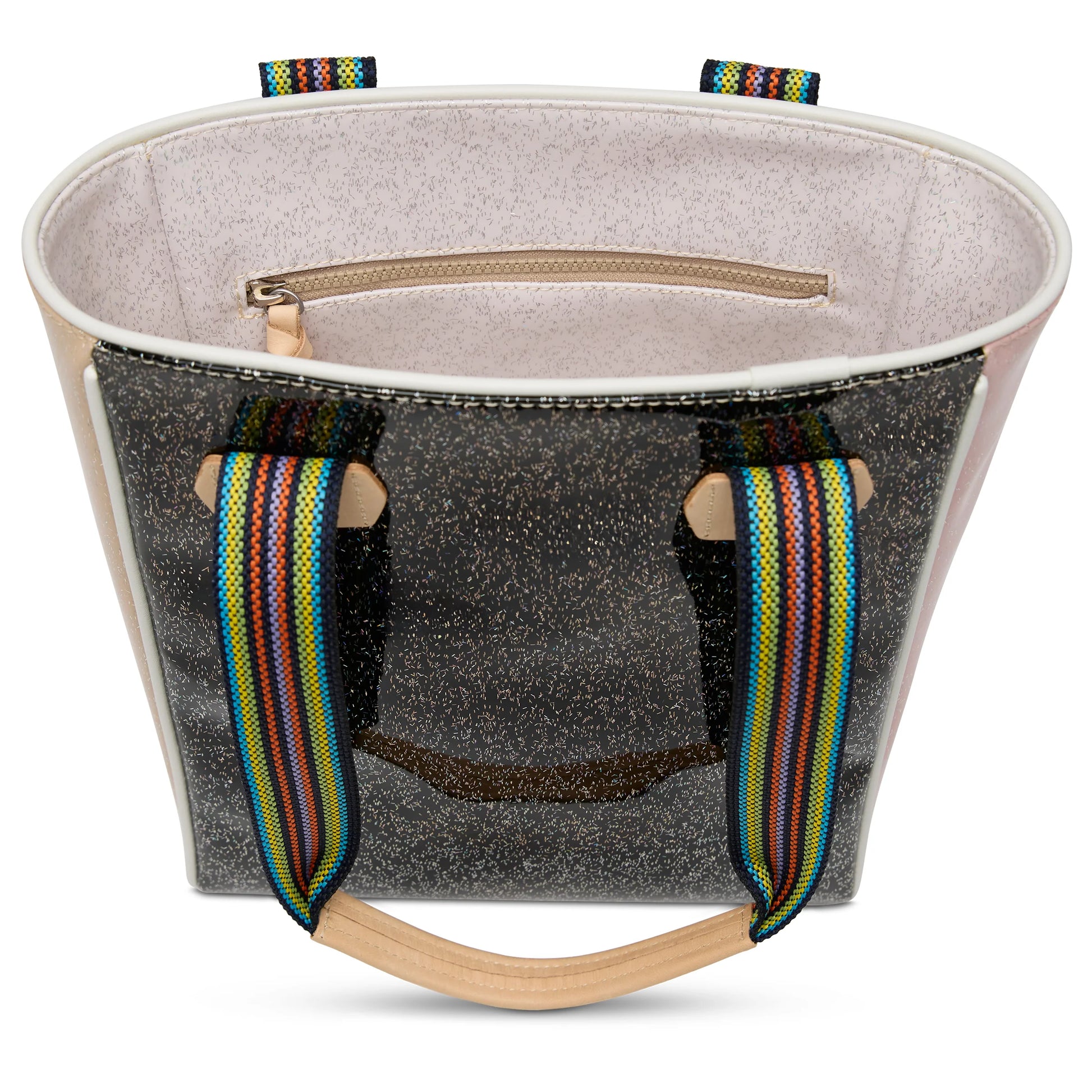 Open handbag with glittery exterior, light interior, zipper pocket, and rainbow-striped handles. Chica Tote, Bae available in multiple sizes.