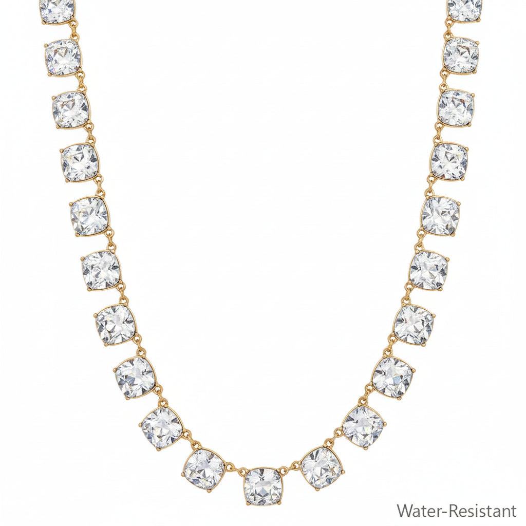 Chil Gold Clear Necklace with evenly spaced square-cut clear gemstones and gold accents, water-resistant. Available sizes: S, M, L.