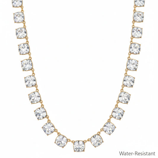 Chil Gold Clear Necklace with evenly spaced square-cut clear gemstones and gold accents, water-resistant. Available sizes: S, M, L.