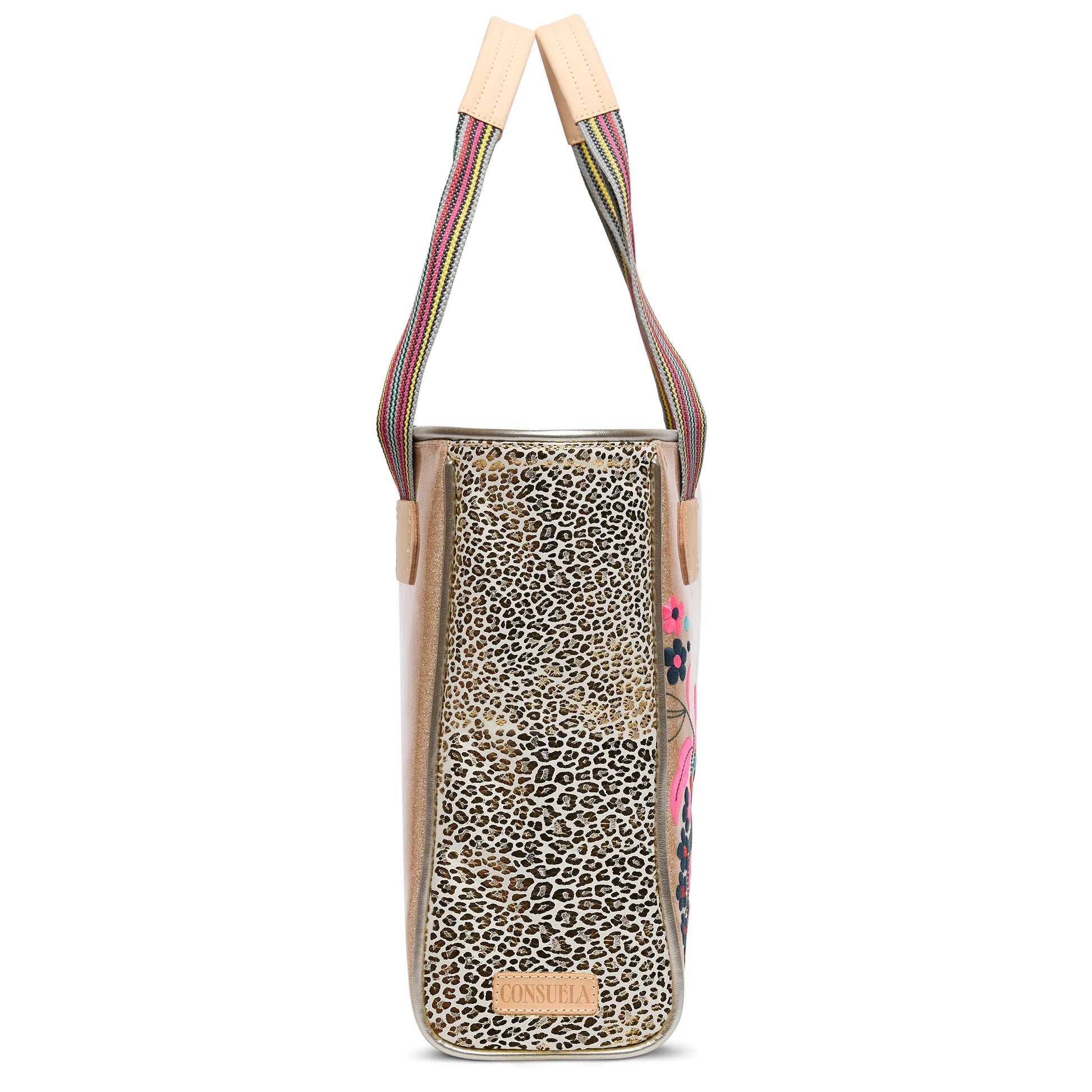 Side view of Classic Tote, Lyla by Consuela—leopard print, striped straps, "Consuela" patch. Available in standard size.
