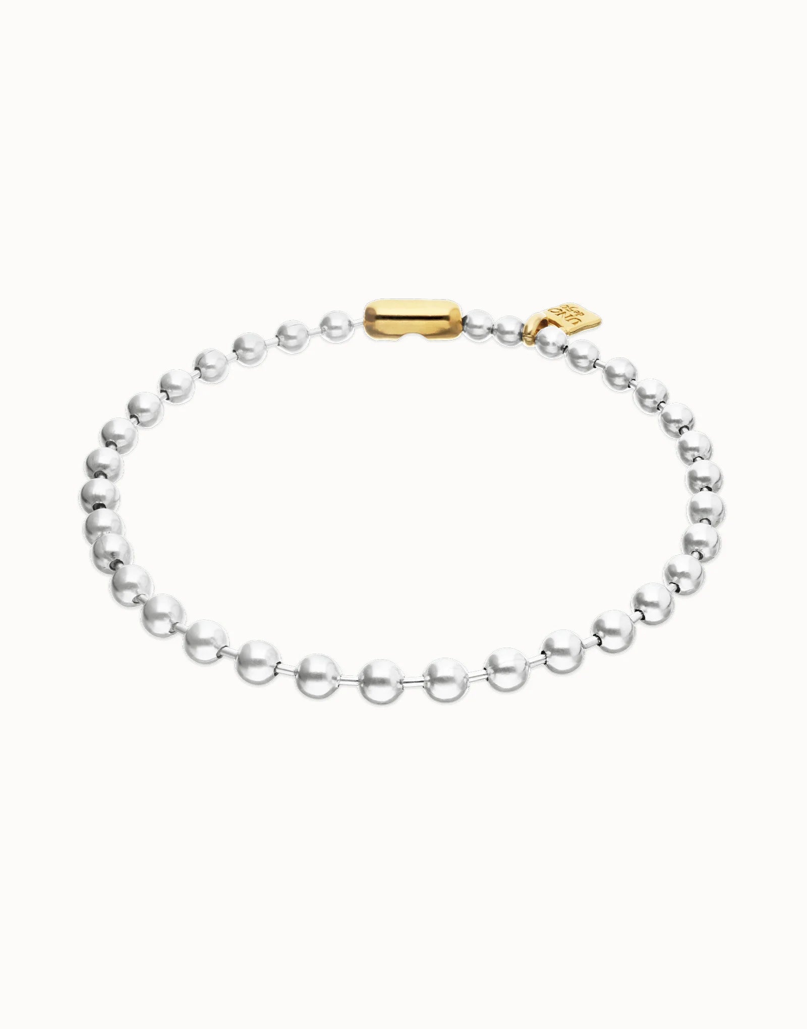 Delicate silver beaded necklace with a gold clasp and small gold tag from the Pálpito Collection, available in multiple sizes.