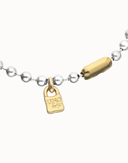 Silver and gold beaded necklace with a gold-toned padlock charm engraved "UNO de 50" and matching clasp. Available in multiple sizes.