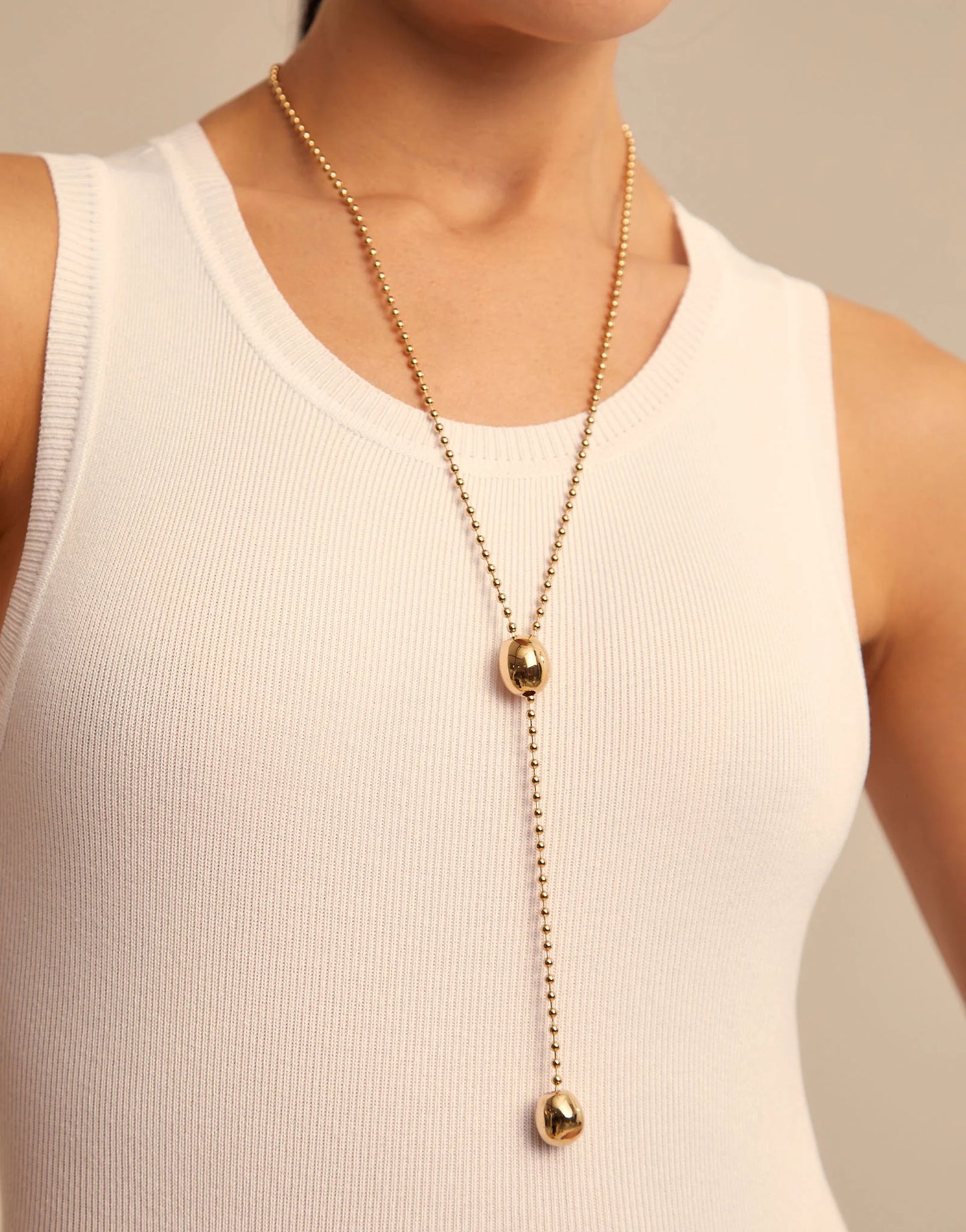 Long Adjustable Chain Necklace in 18K gold plate, handcrafted in Spain with two oval pendants and an adjustable clasp. Available lengths: 24, 30, and 36 inches.