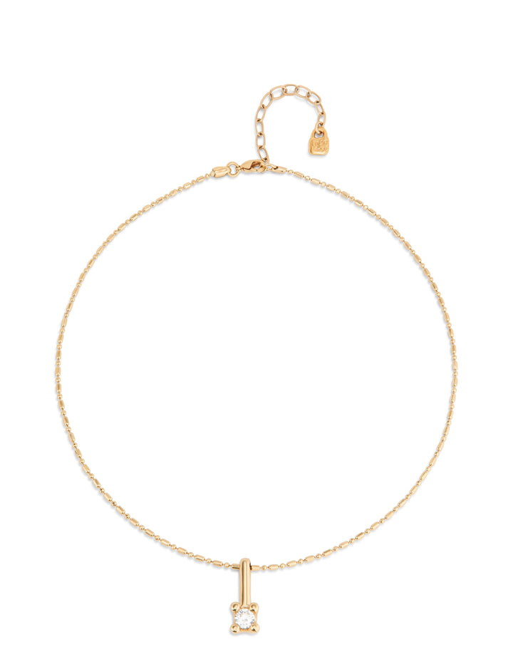 Short Chain Necklace with White Cubic Zirconia, featuring a delicate gold chain, petite round cubic zirconia pendant, adjustable clasp with extender chain, and tiny heart charm. Available in multiple lengths.