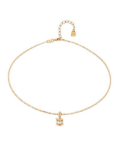 Short gold chain necklace with a white cubic zirconia pendant, adjustable clasp, extension chain, and small tag at the end. Available in 16", 18", and 20" lengths.