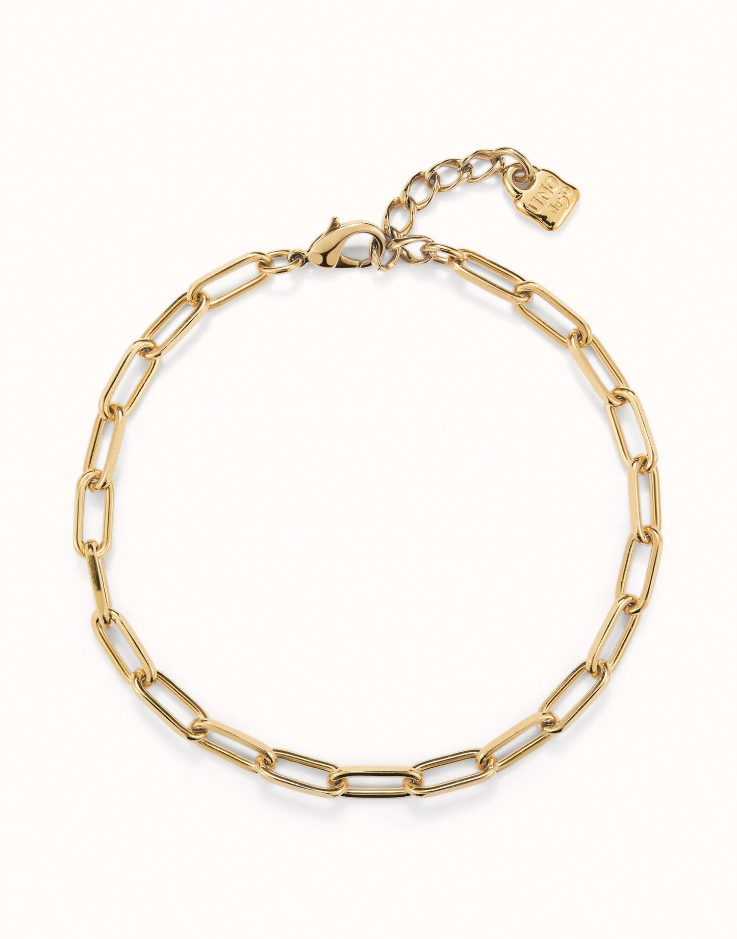 Delicate 18k gold-plated oval link chain necklace with adjustable clasp and small rectangular charm at the extender. Available in 16” and 18” lengths.