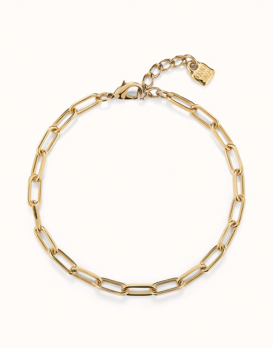 Delicate 18k gold-plated oval link chain necklace with adjustable clasp and small rectangular charm at the extender. Available in 16” and 18” lengths.