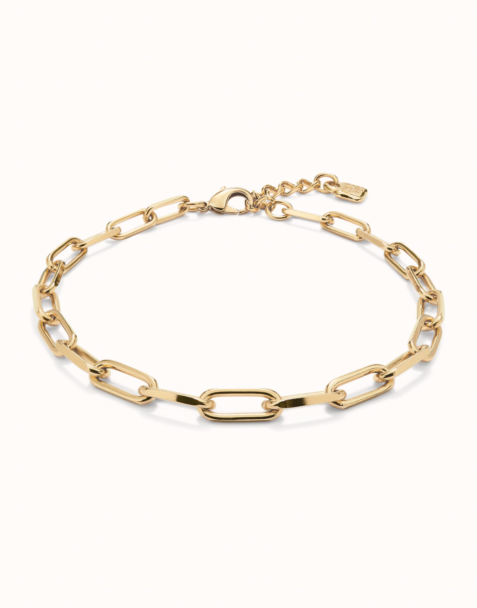 Gold Short Oval Link Chain Necklace with elegant oval links, small adjustable clasp, and tag. 18k gold-plated finish. Available in lengths 16", 18", and 20".