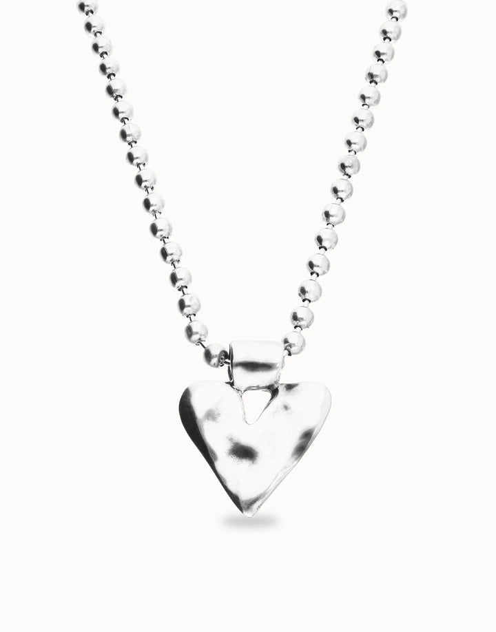 Silver-plated long necklace with beads and a hammered heart-shaped pendant. Available in multiple lengths.