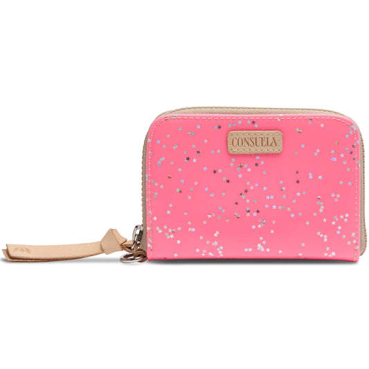 Neon pink patent Zippy Wallet with tan wrist strap, colorful star confetti accents, and beige Consuela logo patch. Compact design for organized carry. Available size: 5” W x 4” H x 1” D.