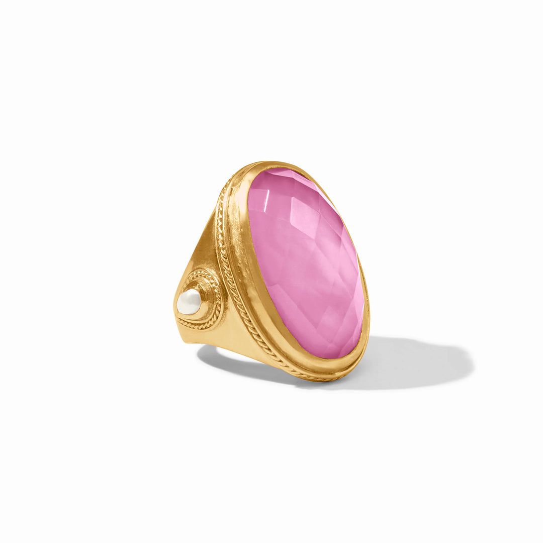 Julie Vos Iridescent Tourmaline Pink Cannes Statement Ring with gold band, faceted oval pink iridescent tourmaline stone, and white pearl accent. Available in sizes 6, 7, 8, and 9.