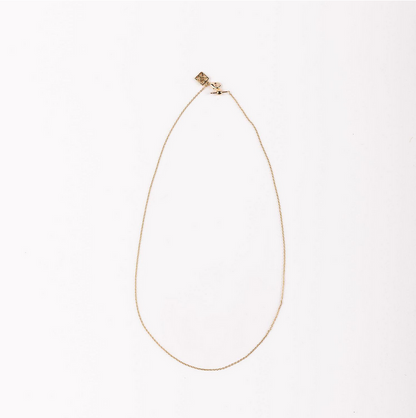 Delicate chain necklace with a small clasp and square pendant. Available in 16", 18", and 20" lengths.
