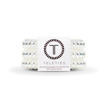 TELETIES Hair Ties are clear spiral hair ties designed for strong grip and no-rip functionality. Available sizes: Small, Large.