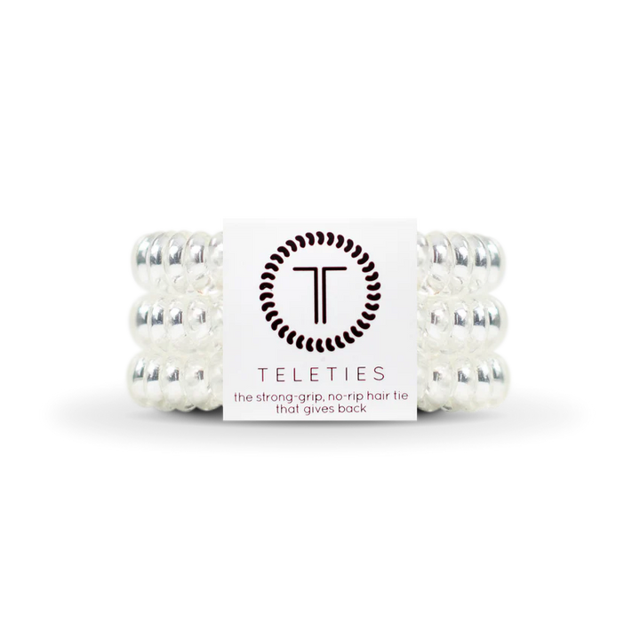 TELETIES Hair Ties are clear spiral hair ties designed for strong grip and no-rip functionality. Available sizes: Small, Large.