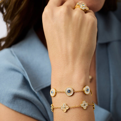 Colette Delicate Bracelet - Champagne: adjustable, gold and white floral charms, blue CZ stones. Sizes: S, M, L.