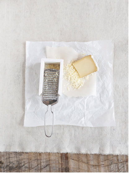 Marble and stainless steel grater available in 7", 10", and 12" sizes. Compact, sleek design.