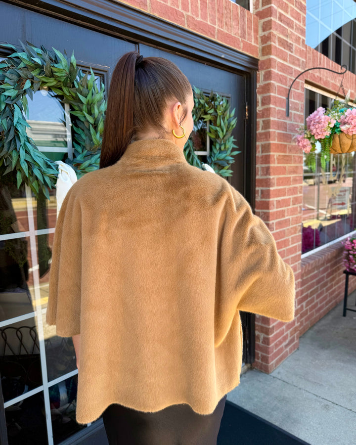 Back view of the tan Arabella Faux Fur Capelet with a high collar. Available in sizes: [Insert sizes].
