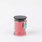 Melon Pop 8 oz candle: small jar, pink soy-blend wax, black lid, blue/pink watermelon tag, available in 8 oz size.