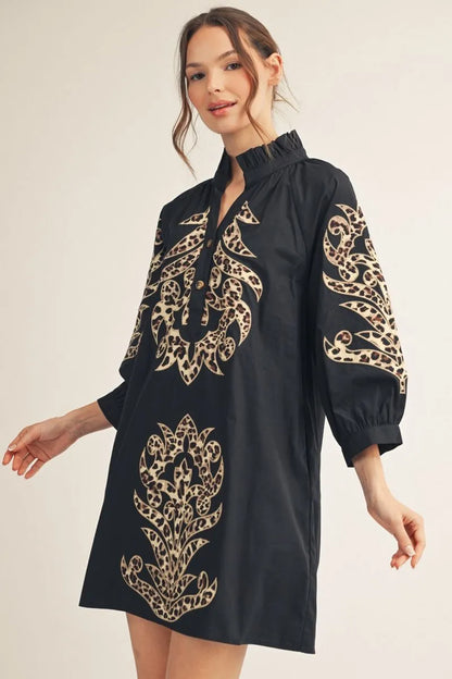 Black & Leopard Baroque Button Up Dress with black long sleeves and beige intricate patterns on front and sleeves. Available in sizes XS–XL.