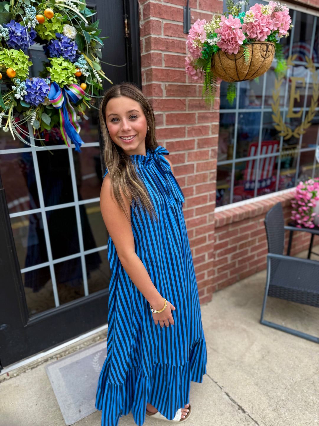 Navy Stripe Tie-Neck Midi Dress, available in sizes XS-XL. Features tie-neck detail and midi length.