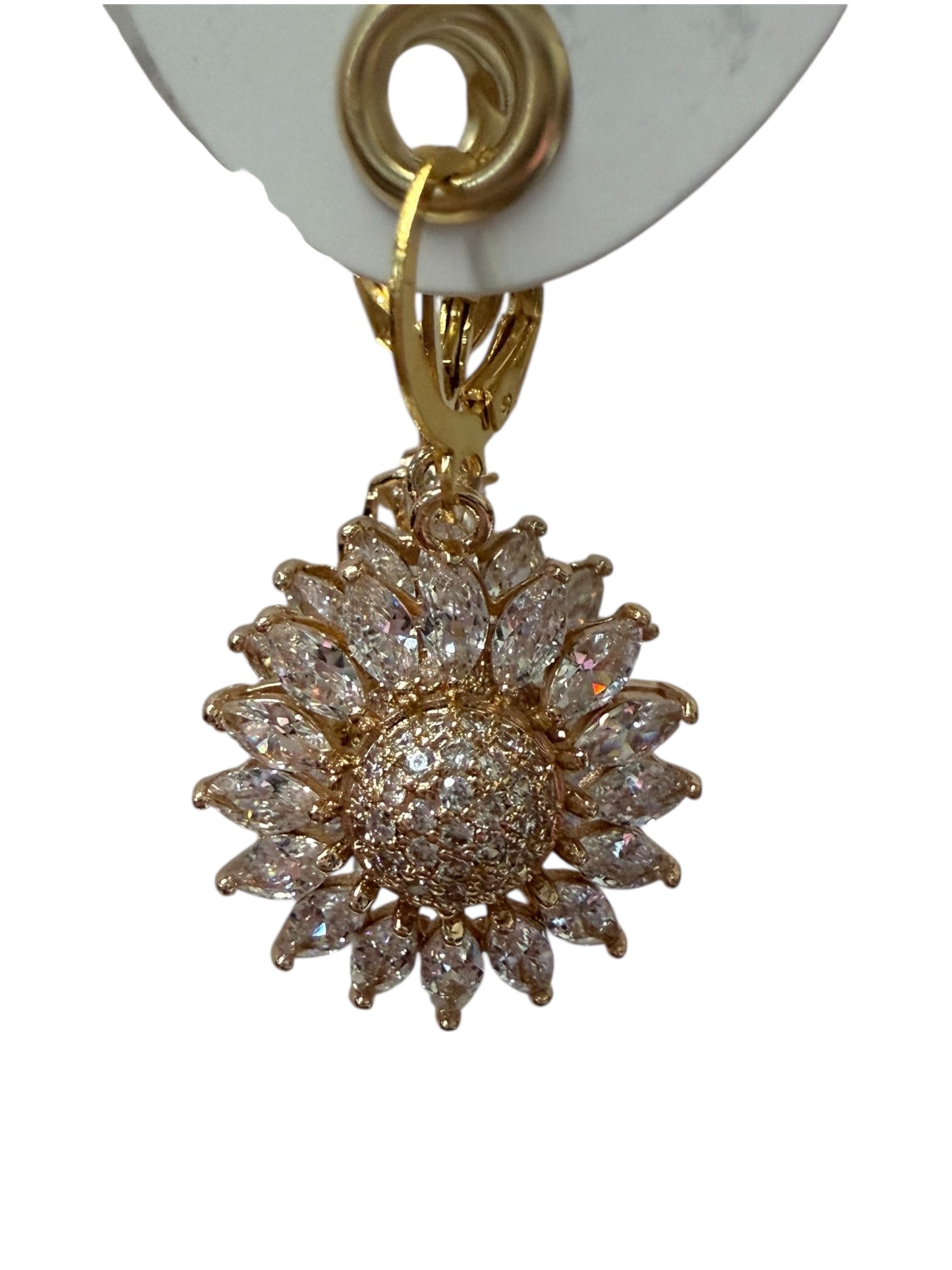 Gold sunflower-shaped earring with clear gemstones on petals and center. Available in small, medium, and large sizes.
