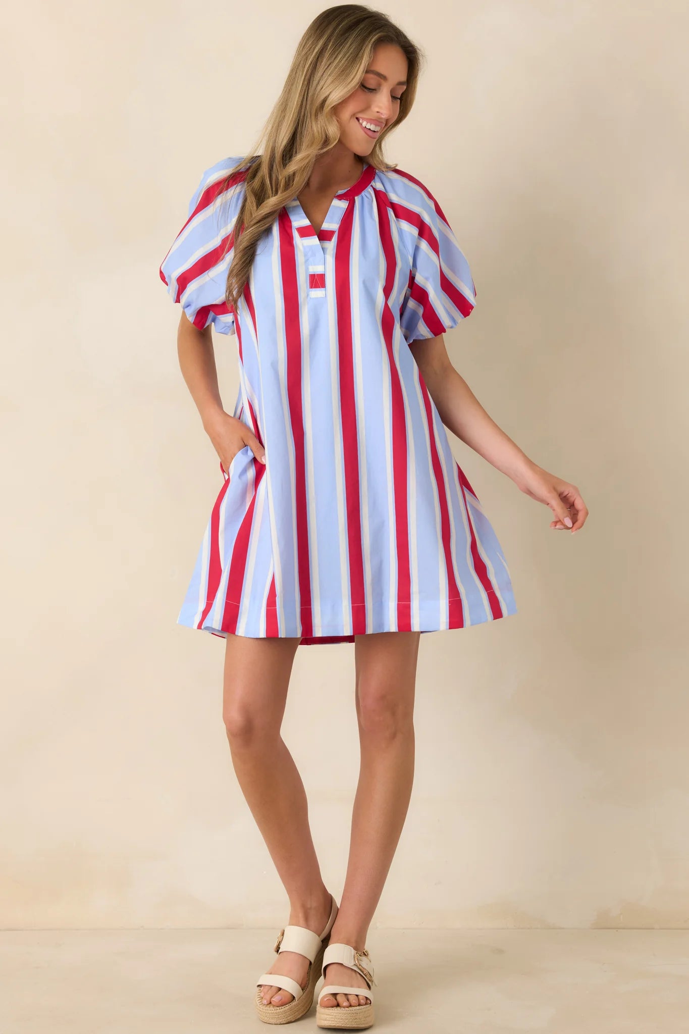 American Darling Stripe Dress with blue and red stripes, puff sleeves. Available in sizes XS-XL.