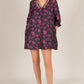 Floral Jacquard 3/4 Sleeve Dress with V-neck and decorative trim. Black dress with pink and purple floral pattern. Sizes: XS, S, M, L, XL.
