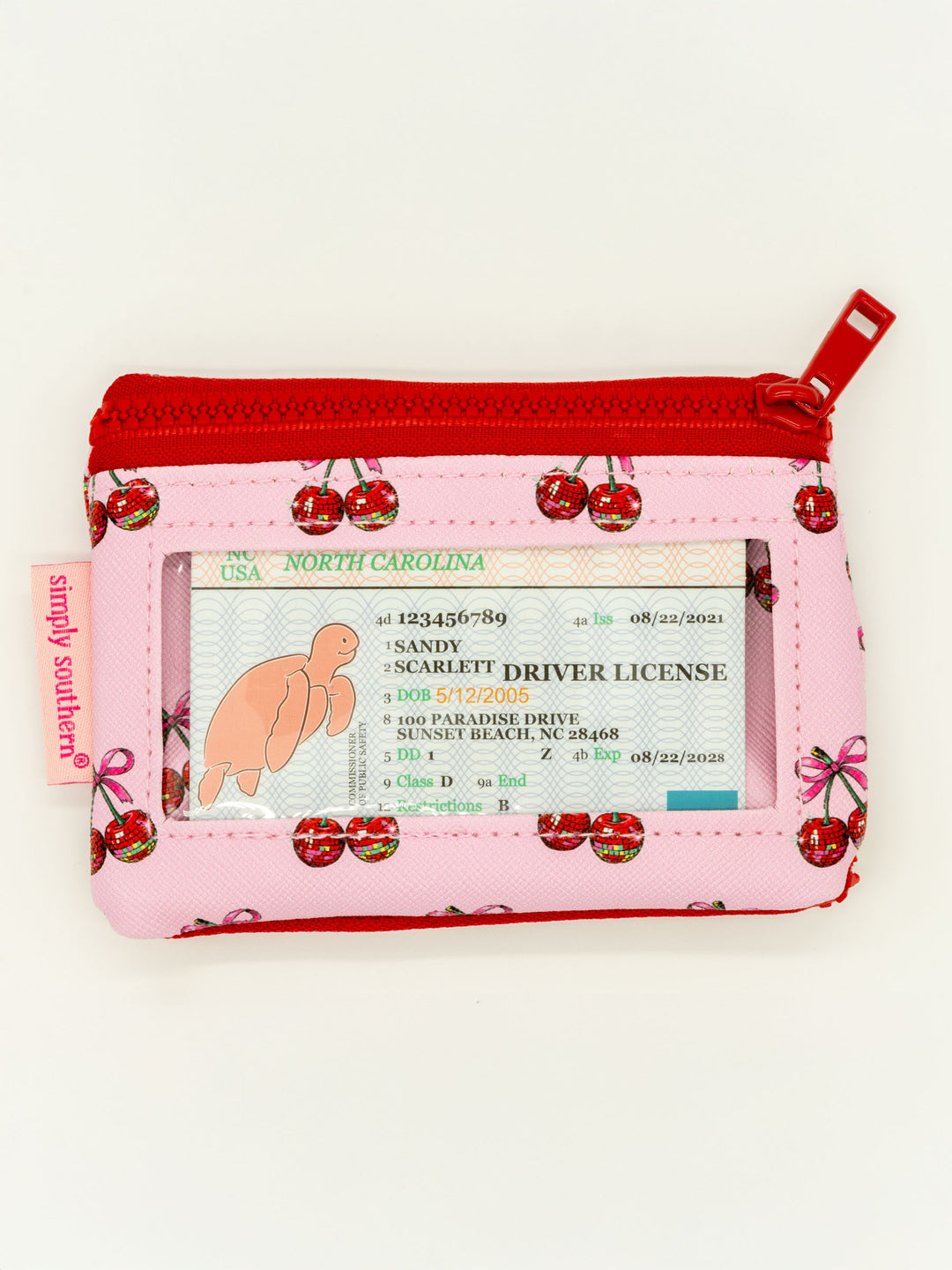 Small pink/red ID wallet with cherry print, zip pocket, clear ID window, "simply southern" tag. Sizes: small.